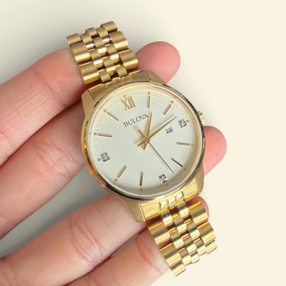 Bulova Gold Timepiece with White Face